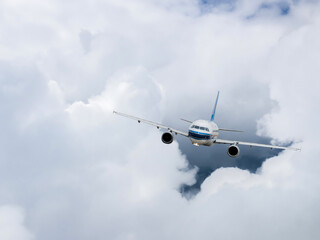 Airplane flying in the blue sky 