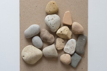 stones on sand-coloured mill board