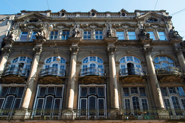 An old residential building with statues in the center of Lviv - 440597400