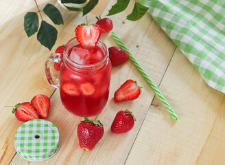 Fresh summer drink with strawberries and ice cubes