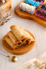 Piscok or banana chocolate is  traditional snacks from Indonesia. made of fried banana wrapped in spring roll skin and assorted melted 
toppings (Chocolate, Taro, Strawberry) 