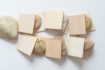 wooden shapes and stones on white