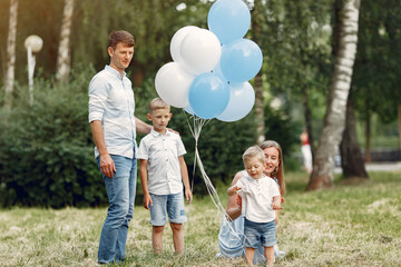 Cute family playing in a summer field