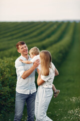 Cute family playing in a summer field