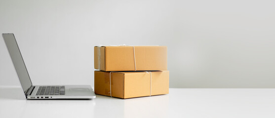Starting small Equipments for SME online business , delivery business laptop, barcode, boxes, checking product on stocks or parcels. Small business working at home office.