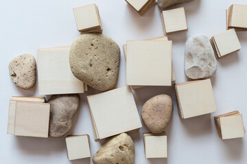 wooden shapes and stones on white