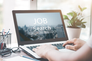 Young men back view online job search using computer app job search, career search and recruitment ideas.
