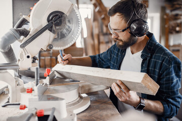 Carpenter working with circular saw