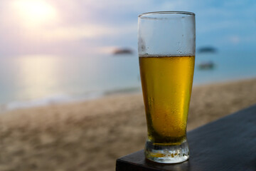 Glasses with light fresh beerฺ or ale   with water drops for drinking to relax on the beach with...