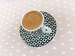 Turkish coffee. Coffee with froth and milk. Coffee cup and tray.