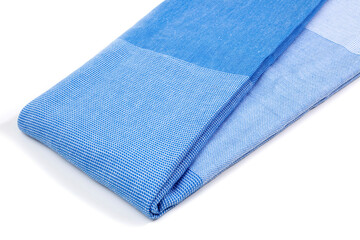 Blue Peshtemal Turkish towel folded colorful textile for spa, beach, pool, light travel, healthy fashion and gifts. Traditional turkish bath material