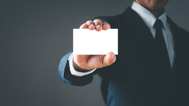 Businessman's Hand hold blank white card mockup with rounded corners. Plain call-card mock up template holding arm. Plastic credit card, namecard display front. Business branding.