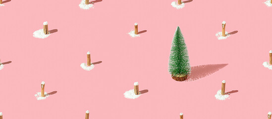 Creative Christmas tree pattern with stumps on a pink background.