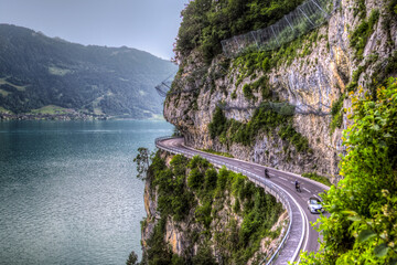 The spectacular motorway on the cliff at the Thun Lake side in Swiss Alps area (HDR Version)
