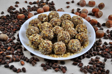 Homemade candy made from nuts on a white plate.