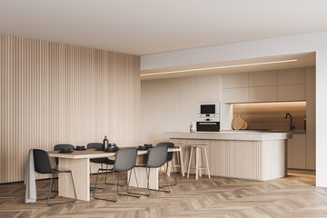 Beige and wooden kitchen corner: table, bar, cabinets