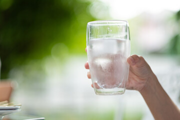 closeup hand drinking fresh water, healthcare concept