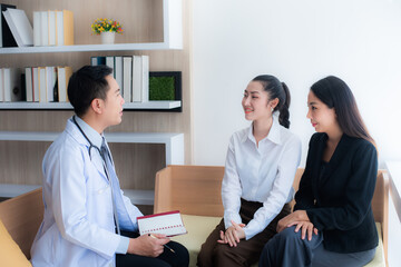 Two Young asian beautiful women is Consulting with a surgeon in a cosmetic clinic to perform cosmetic surgery.