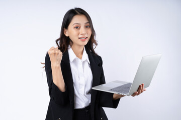Portrait of young businesswoman wearing a suit, isolated on white background