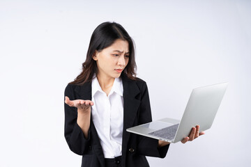 Portrait of young businesswoman wearing a suit, isolated on white background