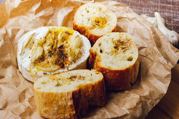 homemade DIY baked camembert with garlic.cheese with white mold.baked cheese.