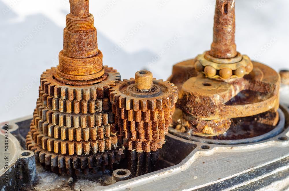 Canvas Prints closeup shot of an old rusty motorbike transmission gearbox isolated on white background