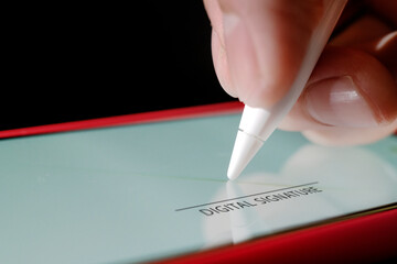 Contract signature  agreemen,  White tablet stylus in hand businessman,Digital signature concept.