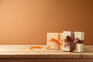 Gift boxes on wooden table. Holidays and autumn season sale concept