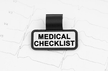 There is a plate on the cardiogram with the inscription - MEDICAL CHECKLIST