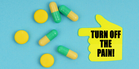 On a blue background, there are pills and a hand-sticker with the inscription - Turn off the pain