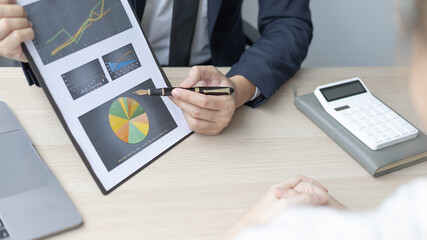 Brainstorm team, Marketers and financial accountants are discussing and analyzing charts to plan strategies to meet customer needs, Team meetings or business consulting.
