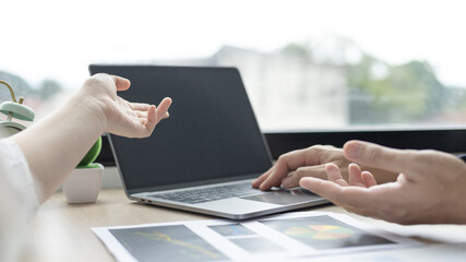 Business brainstorming, Marketers and conference leaders on business plans and marketing strategies using laptops for data analysis, Using business data graphs in meetings.