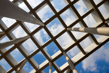 bottom view of the columns holding the canopy of the entrance to the park