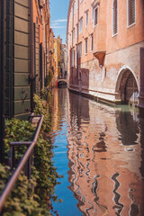 Fototapeta na wymiar narrow canal in Venice and gandolla