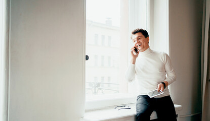 An adult male of European appearance, a lawyer working, calls a work colleague on a mobile phone....