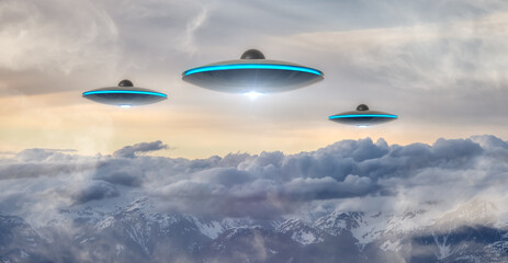 Naklejka na ściany i meble UFO Flying over the Canadian Rocky Mountain Landscape. Art Composite. Alien Visitor Concept. Aerial Background from British Columbia, Canada, near Vancouver.