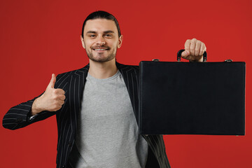 Young smiling successful businessman latin man 20s with ponytail wearing black striped jacket grey...