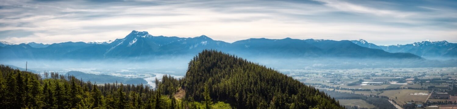 Panoramic View of Fraser Valley from top of the mountain. Canadian Nature Landscape Background. Harrison Mills near Chilliwack, British Columbia, Canada.