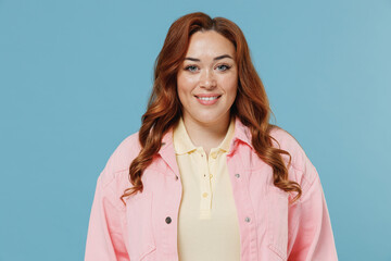 Young fun smiling caucasian redhead chubby overweight woman 30s with curly hair wear pink shirt...