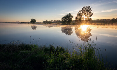 Naklejka na ściany i meble morning landscape with fog on the bank of the Ural river, Russia June
