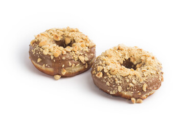 Doughnuts chocolate glazed and nuts covered in composition at studio shot