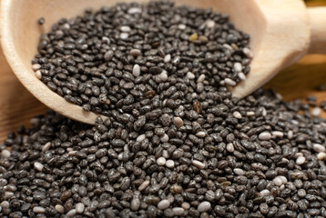 Chia seeds. Chia seeds in a wooden spoon close-up. Slimming & Health Care Product
