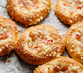 Homemade yeast sweet buns with rhubarb and crumble fokus on the bun inside, close up view