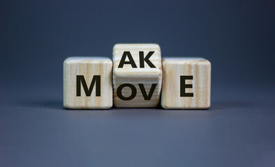 Make your move symbol. Turned wooden cubes with words 'Make move'. Beautiful grey background. Make your move and business concept. Copy space.