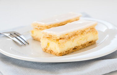 Traditional swiss custard slice with icing (Cremeschnitte in German), close up  - obrazy, fototapety, plakaty