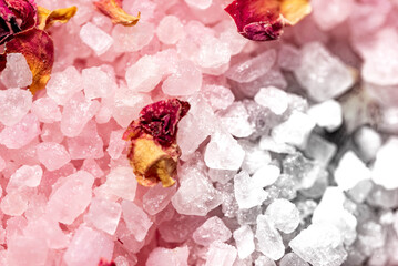 Macro salt crystals with crushed flower petals. Bath salt. Blurry background and shallow depth of field.