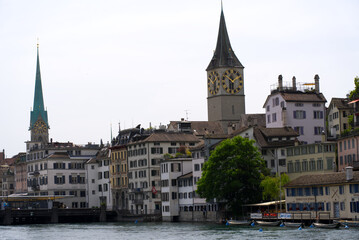 View over the old town of Zurich with churches Fraum&uuml;nster (German, translation is Women's Minster), and St. Peter at summer day. Photo taken June 20th, 2021, Zurich, Switzerland.