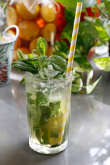 Mojito drink with rum, fresh mint, lime, ice, and water
Refreshing drink, culinary photography.