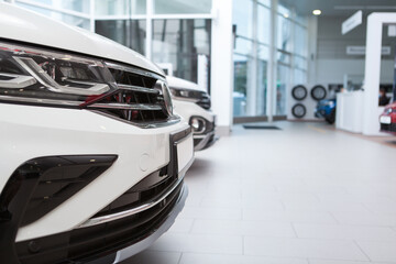 Cropped close up of a new auto for sale at dealership salon, copy space