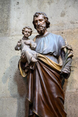 Statue of Saint Joseph holding Infant Jesus in his arms. Votivkirche, Wien – Votive Church,...